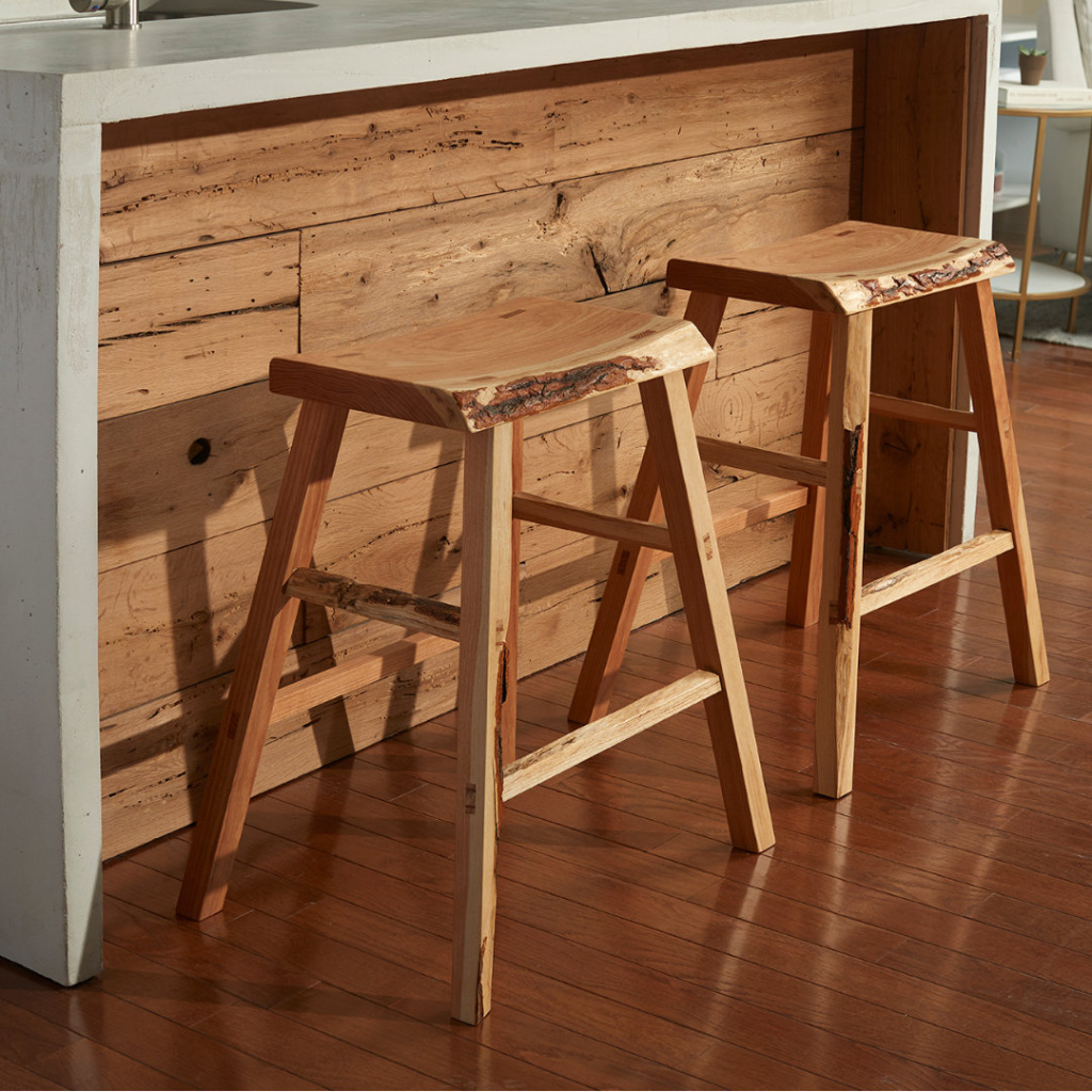Square A pair of live edge honey locust kitchen bars stools seated in front of a modern kitchen island. Handmade in Boston, by furniture maker Thomas J. MacDonald.