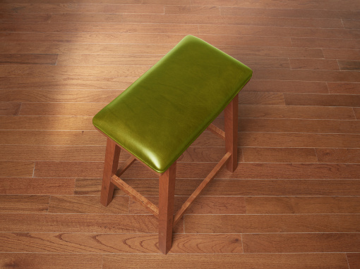 Handmade cherry kitchen barstool with London Apple Italian leather seat on hardwood floor.