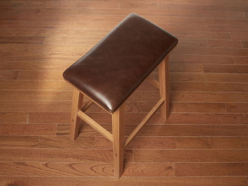Handmade red oak kitchen barstool with London Cigar Italian leather seat on hardwood floor.