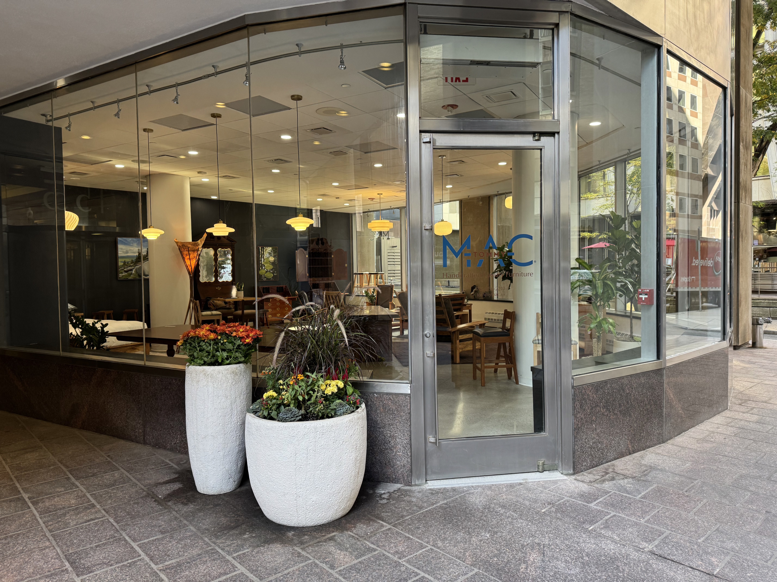 Gallery front A view onf the front door looking into The Tommy Mac Furniture Gallery at 155 Federal Street in Downtown Boston