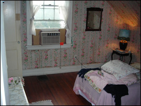 Traditional pink floral wallpaper covers the walls in the Schmidt’s new master bedroom. Photo courtesy of Mike Schmidt.