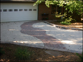 A pervious concrete driveway absorbs water instead of shedding it. If a municipality has tight environmental regulations for residential construction, this type of driveway may be required. Photo courtesy of Gordon Kenna, Georgia Concrete and Products Association.