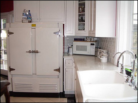 Kezia Jauron's refrigerator old-school commercial fridge is from the 1940s; its previous home was in a pharmacy. Though it's been thoroughly reconditioned, it's still just a fridge—she had to buy a separate freezer and hide it behind cabinetry. Photo credit: Kezia Jauron
