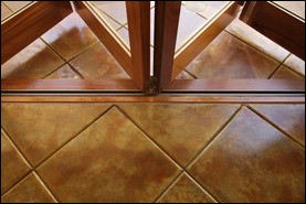 Concrete is stamped and stained to mimic the look of terracotta tile. The same design was used indoors and out to tie together the two spaces. Photo courtesy of Life Deck Specialty Coatings in San Diego.
