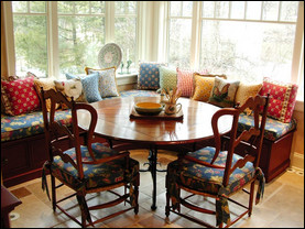 A wide banquette installed near a window provides a prime spot for bird watching, working on a laptop or napping. Photo courtesy of Susan Serra, CKD.