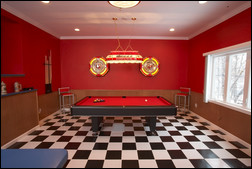 If you have the square footage, a pool table can be an entertaining addition to any man space. © Francis Harvey & Sons. Photo by Christopher Navin.