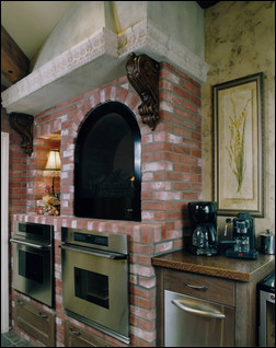 Oklahoma City-based kitchen designer Karen Black-Sigler appreciates the texture that stone and brick veneer can bring to a room. She’s incorporated both into her own kitchen. Photo courtesy of A Karen Black Company.