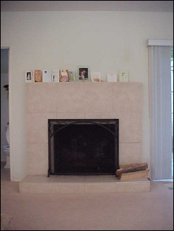 BEFORE. Fireplace surrounds are one of the most common uses for stone veneer. As these photos show, it can dramatically change the look of a space. Photo courtesy of Russ Hemmis.