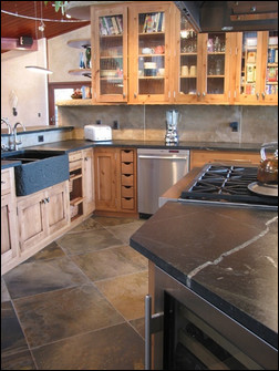 Slate Floors and Countertops Stone floors and countertops, like these made of natural slate, can be low-maintenance surfaces. Photo courtesy of El Dorado Stone.