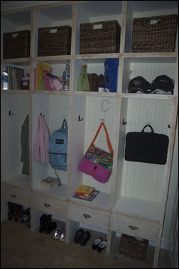 Niki Bell's mud room includes lockers with no doors and hooks with each family members' initials. Photo credit: Niki Bell