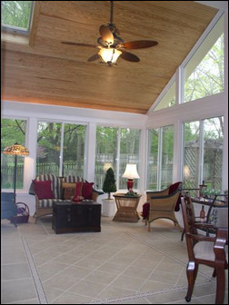 This spacious, finished porch features high ceilings, lighting and great views of the great outdoors. Photo courtesy of Edwards Construction.