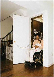 Residential elevators provide the best accessibility for most wheelchair users. They are most economical when installed in new construction, but can be retrofitted into many existing homes. Note the homeowner's chain installed on the door's inside face that allows her to pull it closed once she is inside.