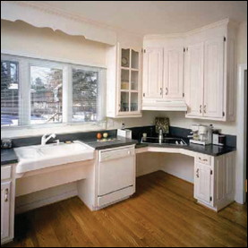This accessible kitchen has lowered countertops and kneespace for the sink and cooktop. Note that the dishwasher countertop can not be lowered. Carefully consider the safety implications before you elect to install a kneespace below your cooktop.
