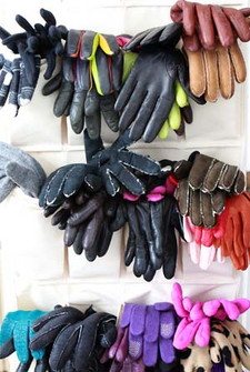 Canvas shoe organizers keep gloves in pairs and at eye level.